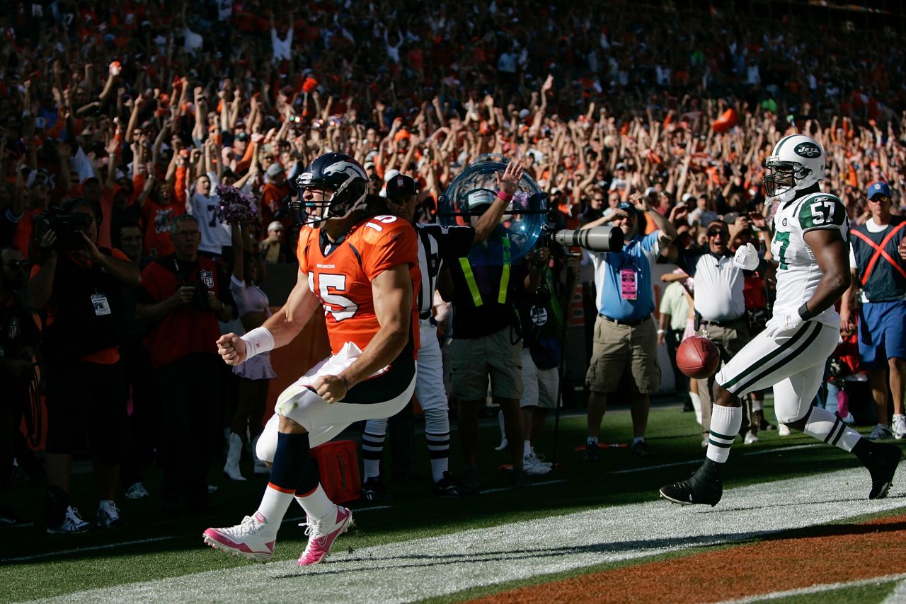 Tebow celebrates his first NFL touchdown run in October 2010.
