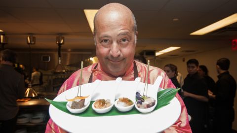 Zimmern prepares food for guests at the SUS fundraising dinner