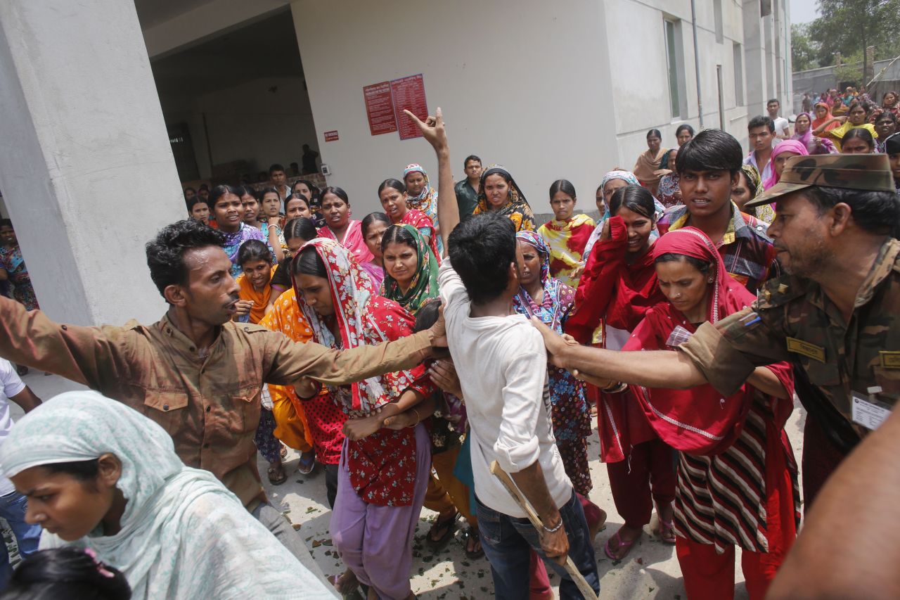 Garment workers block a street during a protest Monday, April 29.