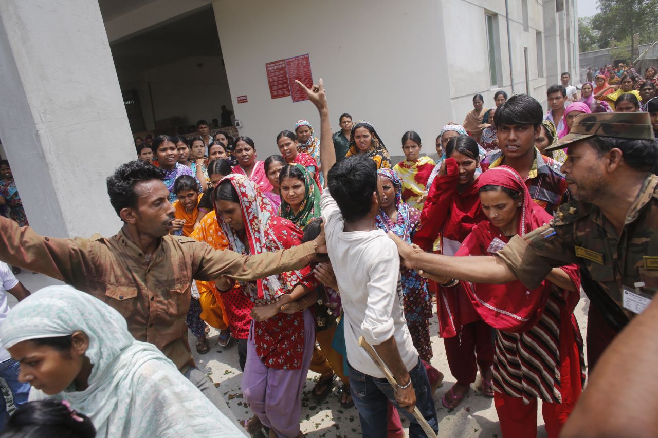 Garment workers block a street during a protest Monday, April 29.