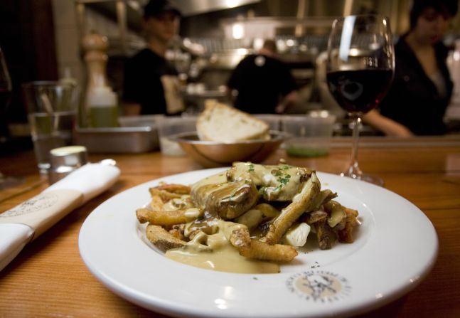 This poutine au fois gras sits on a table at Le Pied de Cochon in Montreal. Poutine is a traditional Quebecois dish consisting of fries, sauce brune (gravy) and cheese curds that's been reinvented by some upscale restaurants.