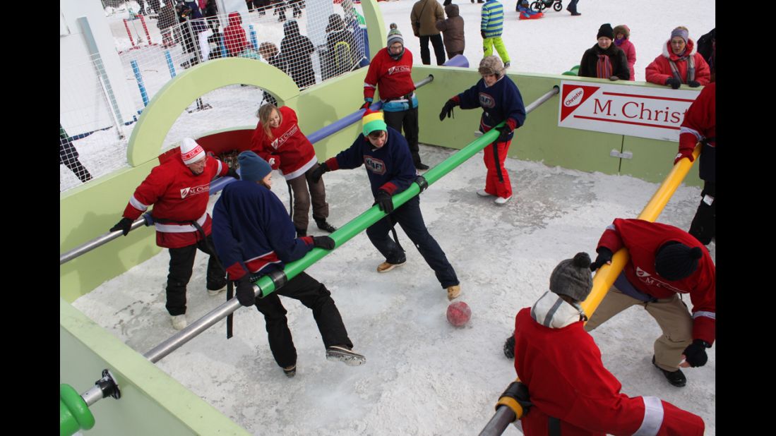 Residents play a game of human table football during the Quebec winter carnival in Quebec City. Carnaval du Quebec is held every February in Quebec City, and the success and sheer size of the event is a testament to Quebecers' defiance toward the cold.<br />