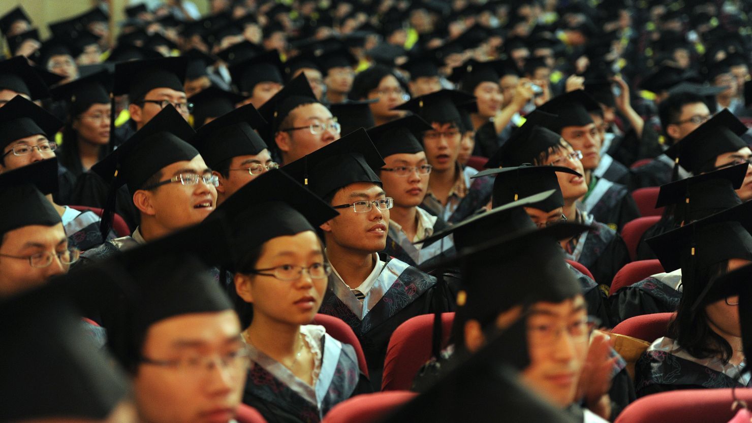 File image from 2012 shows students graduating in Anhui Province -- many students are targeted for recruitment by the party.