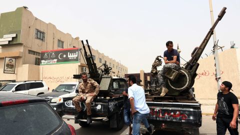 Armed men in trucks with anti-aircraft guns mounted on them occupied the Libyan Justice Ministry in Tripoli.