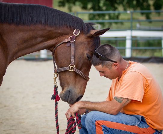 David and Ace of Hearts share a moment. "Every time I go to the barn, I can tell someone has changed by being around these horses," Tucker said.