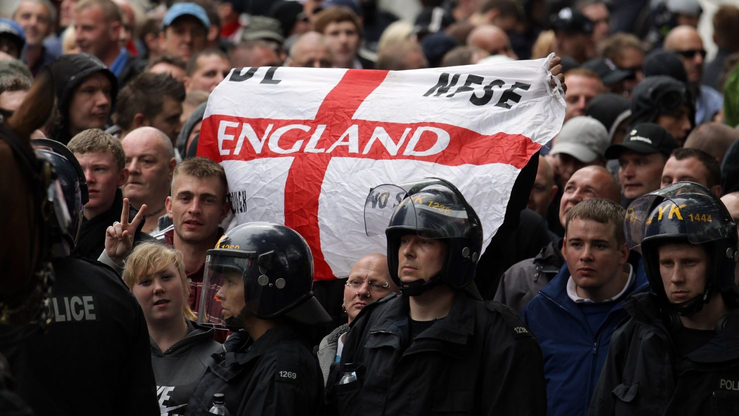 Police escort members of the English Defence League through Bristol on July 14, 2012.