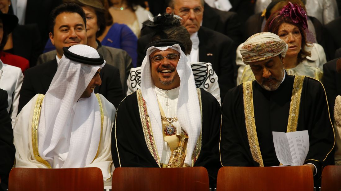 Emirati businessman Sheikh Hamed bin Zayed al Nahyan, left, attends the investiture ceremony.