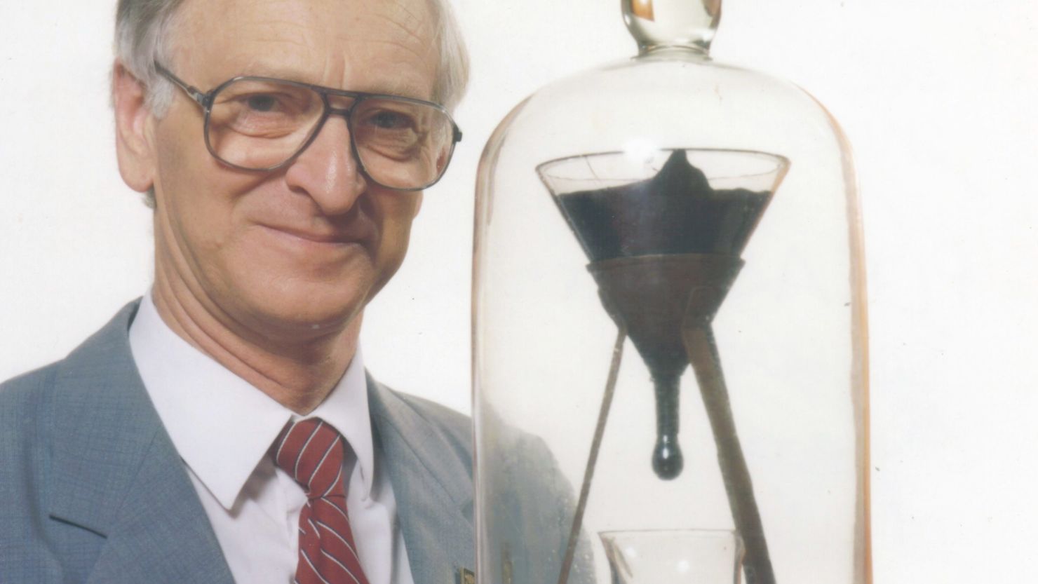 Professor John Mainstone with the eighth drop in late 1990, about 2-1/2 years after the seventh drop fell.