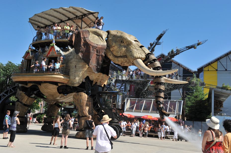 The 12 meter-tall hydraulic mammal tramples his way around the park, carrying almost 50 passengers on its back -- and spraying unsuspecting visitors with water as he passes.