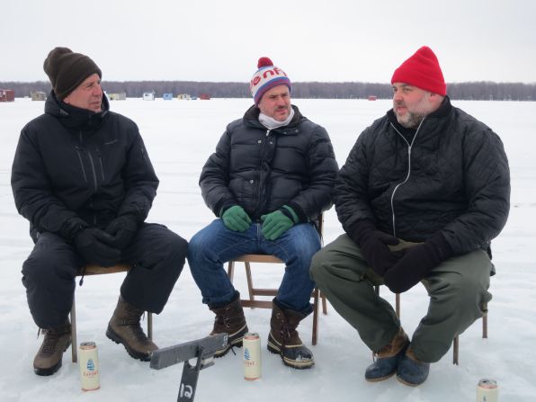 Anthony Bourdain ice fishes with Fred Morin, center, and Dave McMillan, co-owners of the Montreal restaurant Joe Beef, on the Rivière du Nord in St-André d'Argenteuil in mid-February. They're safely atop 2 feet of solid ice that's over 100 feet of water.
