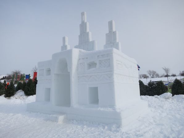 The crew of "Anthony Bourdain Parts Unknown" stops to admire an ice castle at the Quebec Winter Carnival.