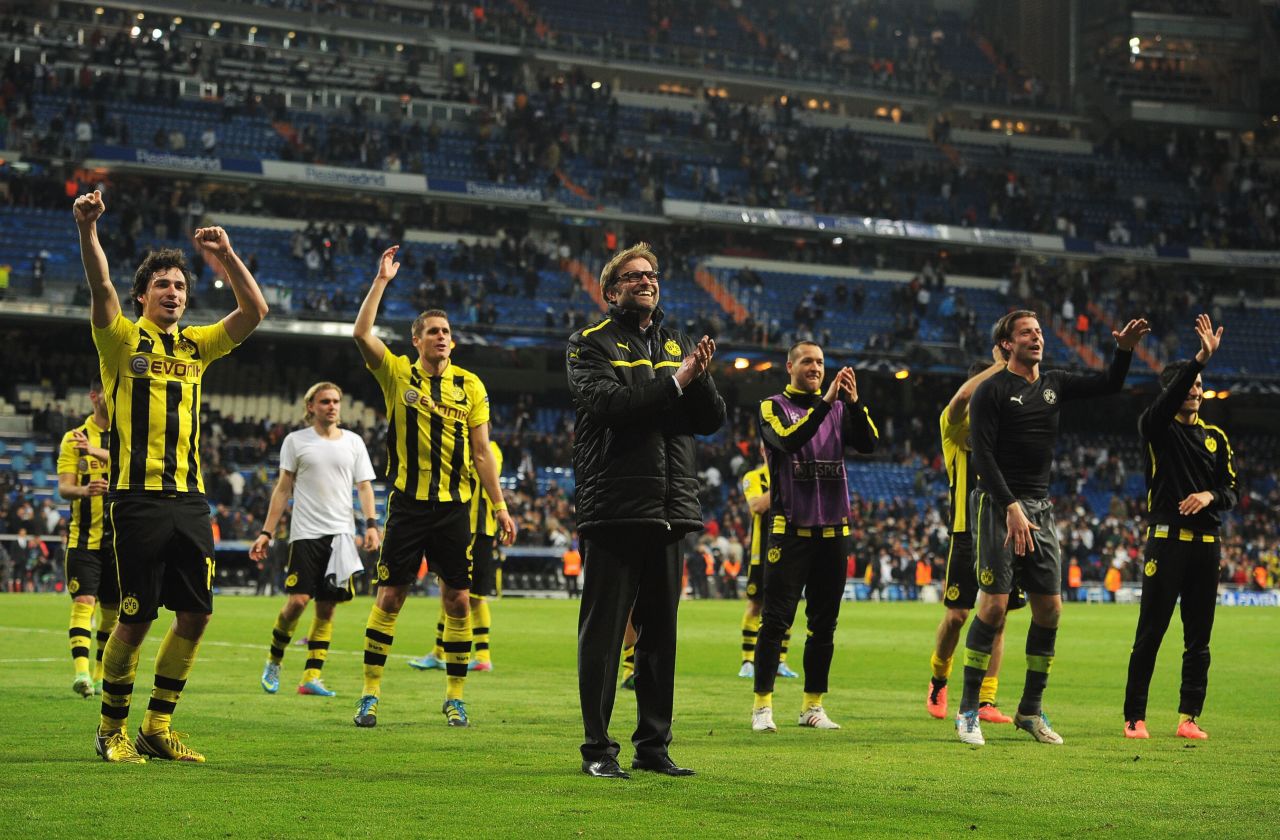 Dortmund manager Jurgen Klopp celebrates with his players following the 2-0 defeat which allowed his side to qualify for the final 4-3 on aggregate. It is the first time since 1997 that Dortmund has reached the final when it defeated Juventus 3-1.