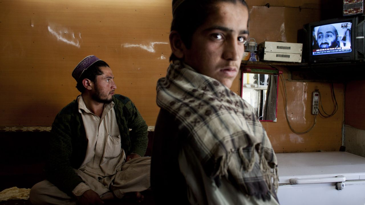 Afghans watch television coverage in Kabul announcing the killing of bin Laden.