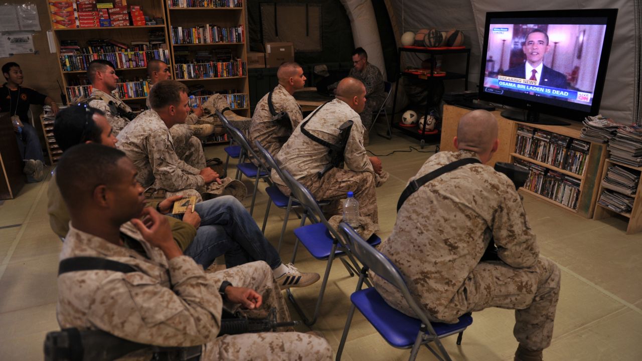 U.S. Marines watch the announcement of bin Laden's death at Camp Dwyer in Helmand Province, Afghanistan.