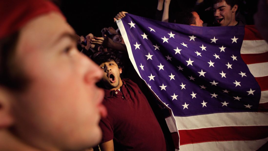 Students gather to celebrate at the fence on the north side of the White House.