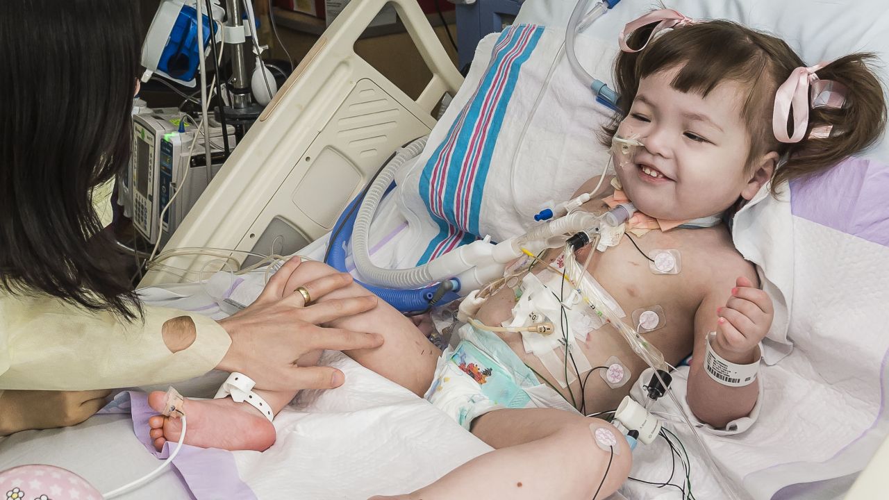 Hannah Warren, 2, recovers in a post-op room at the Children's Hospital of Illinois in Peoria.