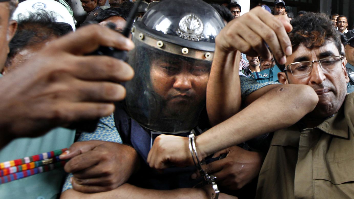 Sohel Rana, owner of the collapsed Rana Plaza building, wears police-issued body armor and a helmet while being escorted to court in Dhaka on Tuesday, April 30. Rana was arrested near the Indian border, and protesters called for him to be hanged.