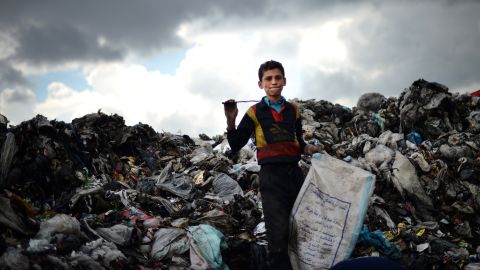 A young Syrian boy collects plastic and metal items in a garbage dump in the northern Syrian city of Aleppo earlier in April.