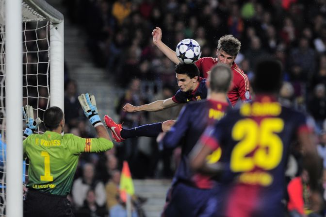 Thomas Mueller heads home Bayern Munich's third in the 3-0 second leg win over Barcelona to complete a 7-0 aggregate triumph.