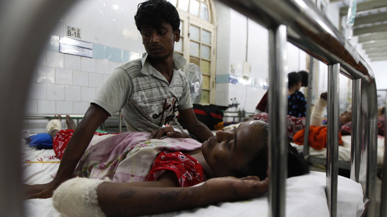 A garment worker rescued from the wreckage of the Rana Plaza building lies in a hospital in Dhaka on Thursday, May 2.