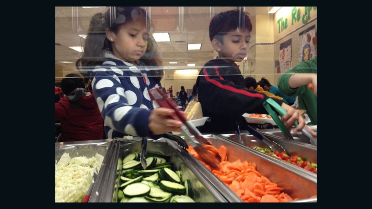 Students at the Active Learning Elementary School in Queens check out the cafeteria salad bar.