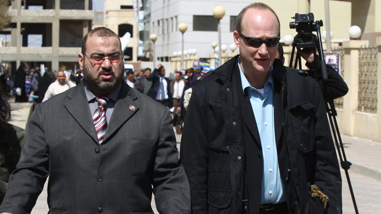 U.S. national Robert Becker, right, leaves court in Cairo after a trial on allegedly illegally funded NGOs on March 8, 2012. 