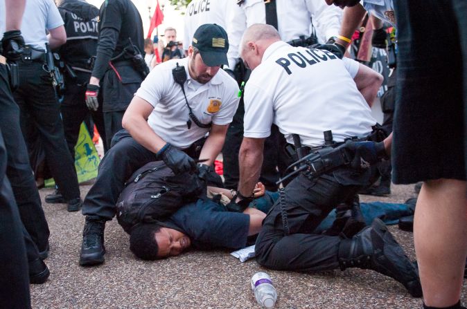 Photographer <a >Michael Kandel </a>was out at the May Day protest in Washington yesterday evening when protesters veered off the marching path and stormed a GAP store. Police intervened to secure the entrance and a skirmish broke out, according to CNN.