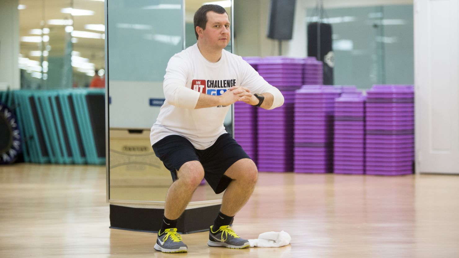 Douglas Mogle does a squat during the Fit Nation kick-off weekend in Atlanta. 