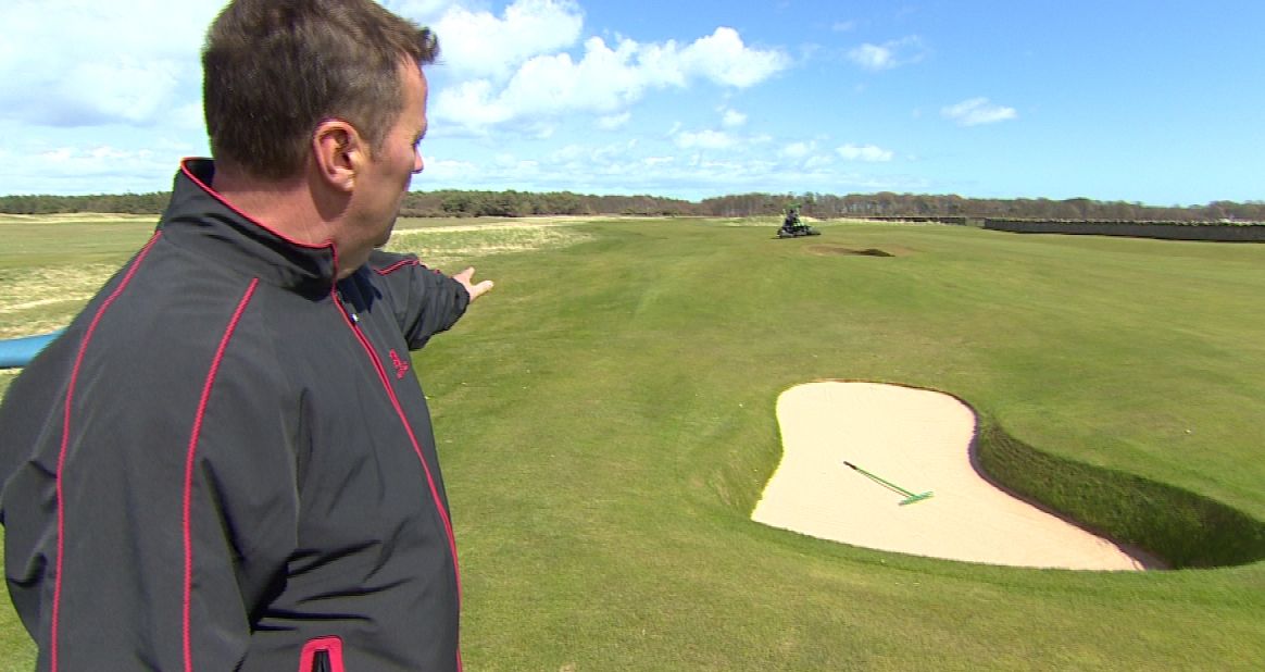 Muirfield course manager Colin Irvine shows the new bunker that has been dug out at the ninth hole.