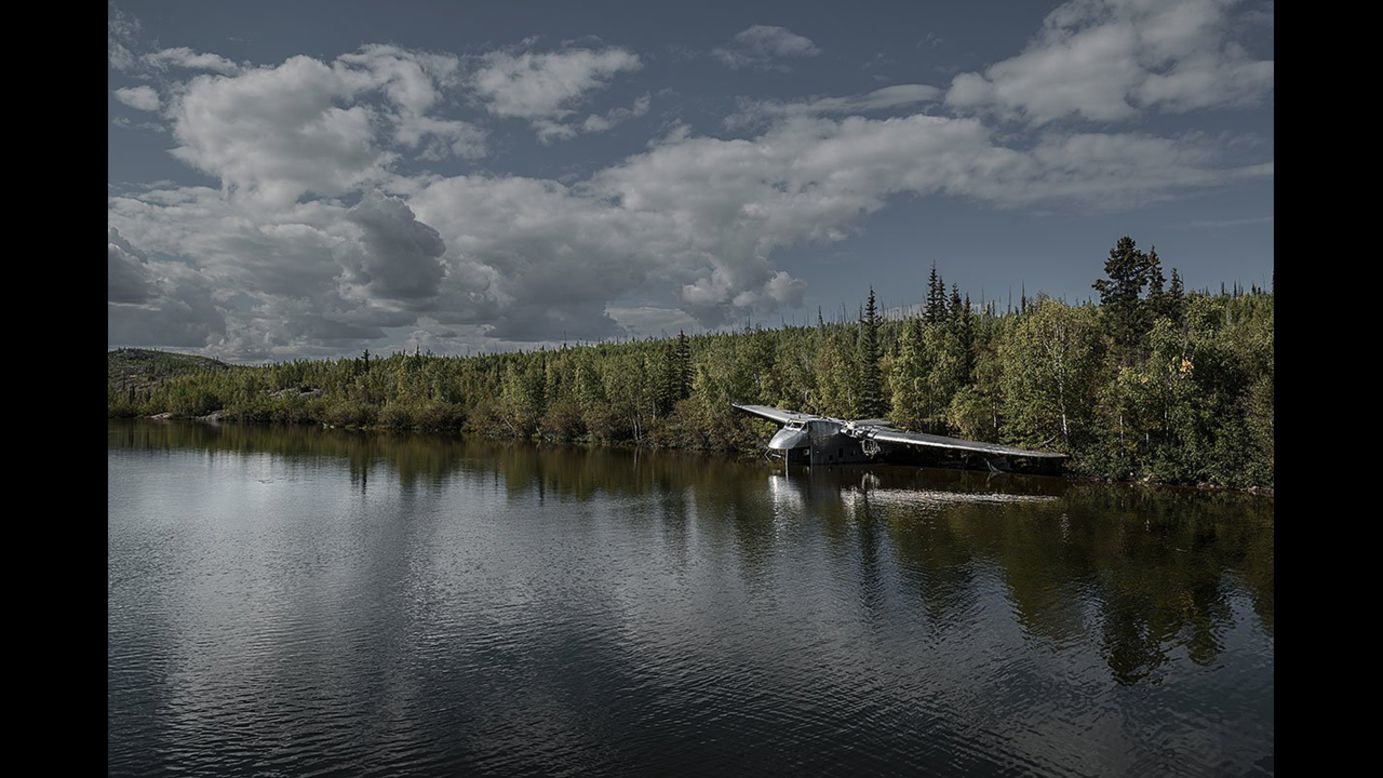 A Bristol 170 Freighter, lost in 1956, appears to take a drink of water in Canada's Northwest Territories. Eckell's other photographic work of "abandoned objects" includes Cold War relics, overgrown adventure parks and Olympic sites.