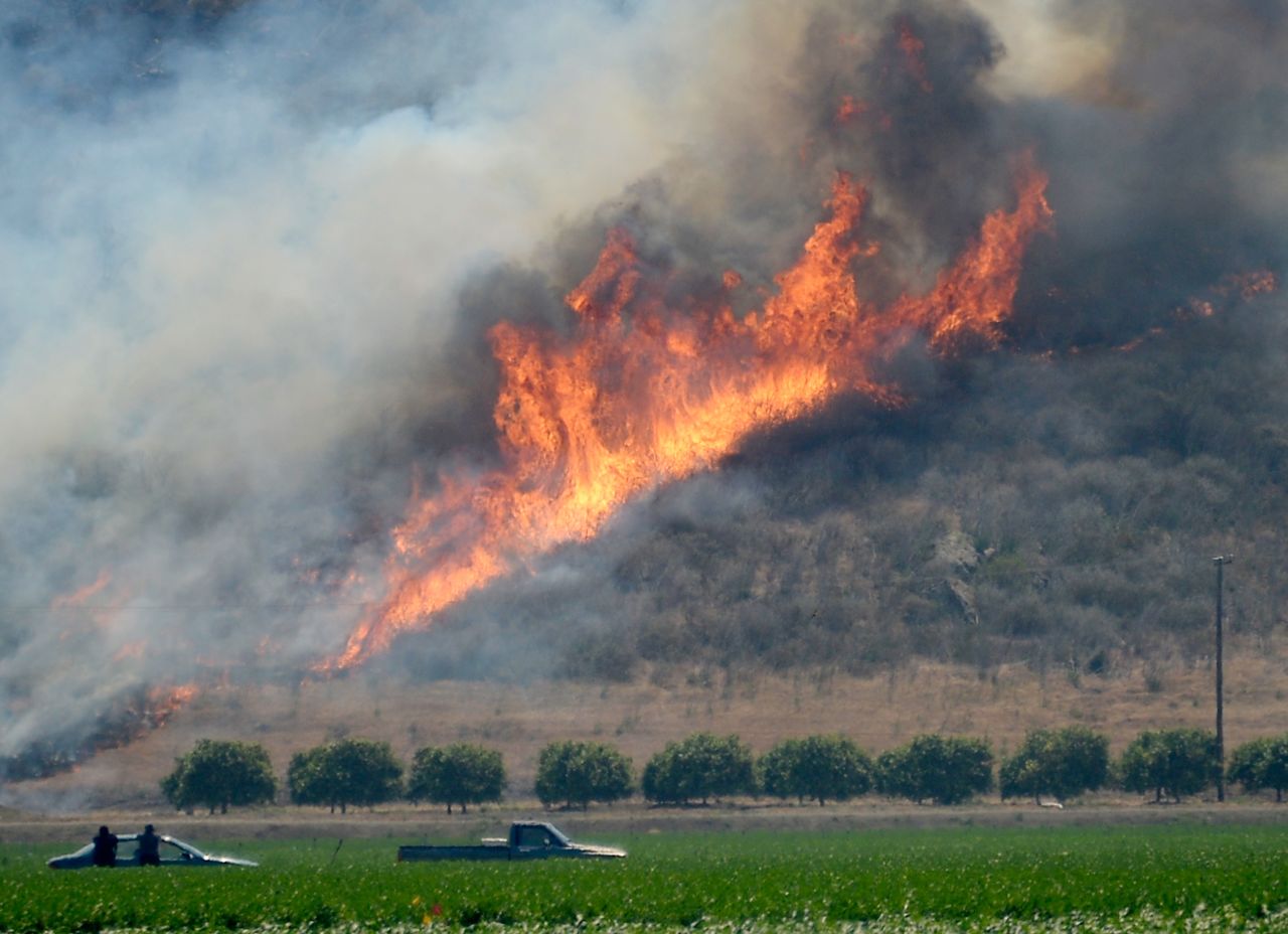 The wildfire burns out of control near an farm in Camarillo, California, on Thursday. Nearly 600 fire and law enforcement personnel were assigned to battle the blaze.