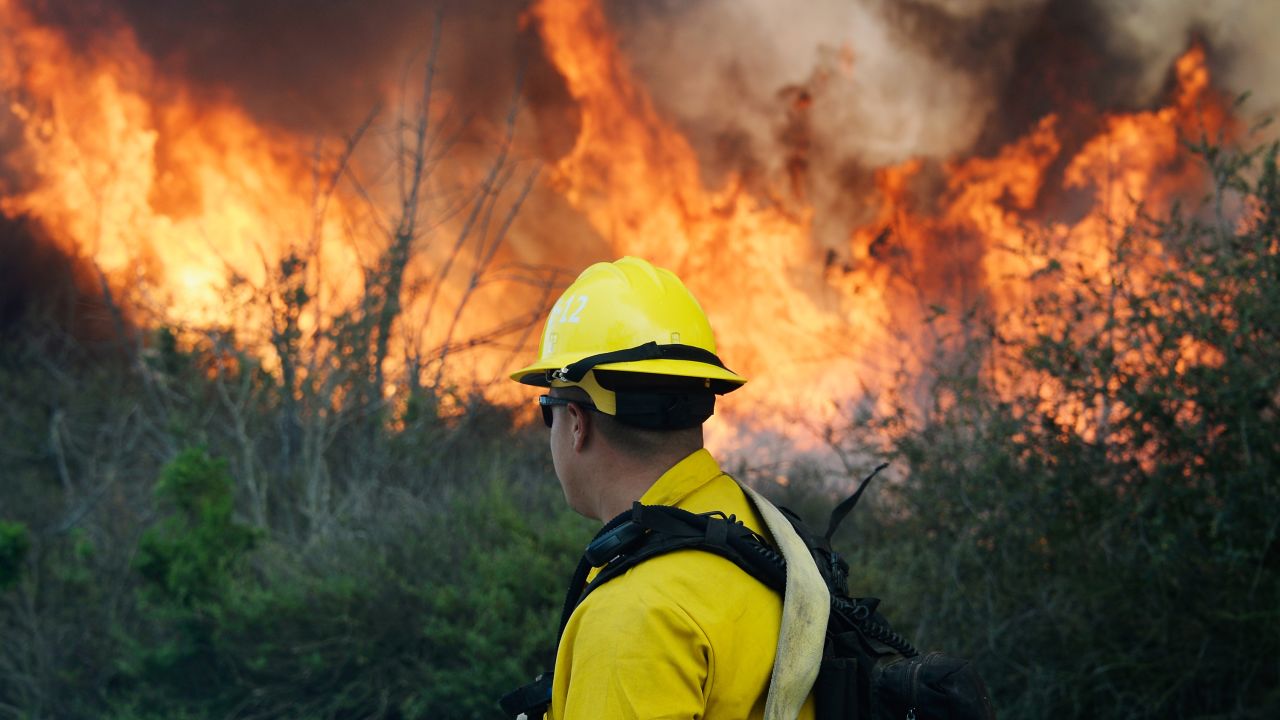 A firefighter prepares to push back against the flames in Camarillo on May 2.
