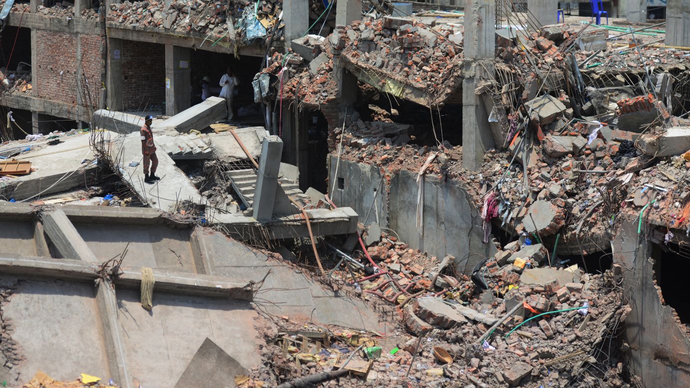 A man stands amid the destruction as rescue and army personnel continue recovery operations on May 3.