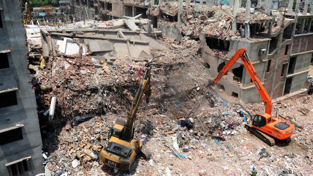 Rescue workers dig out debris from the Rana Plaza building as Bangladeshi army personnel continue the second phase of a rescue operation using heavy equipment on Friday, May 3.