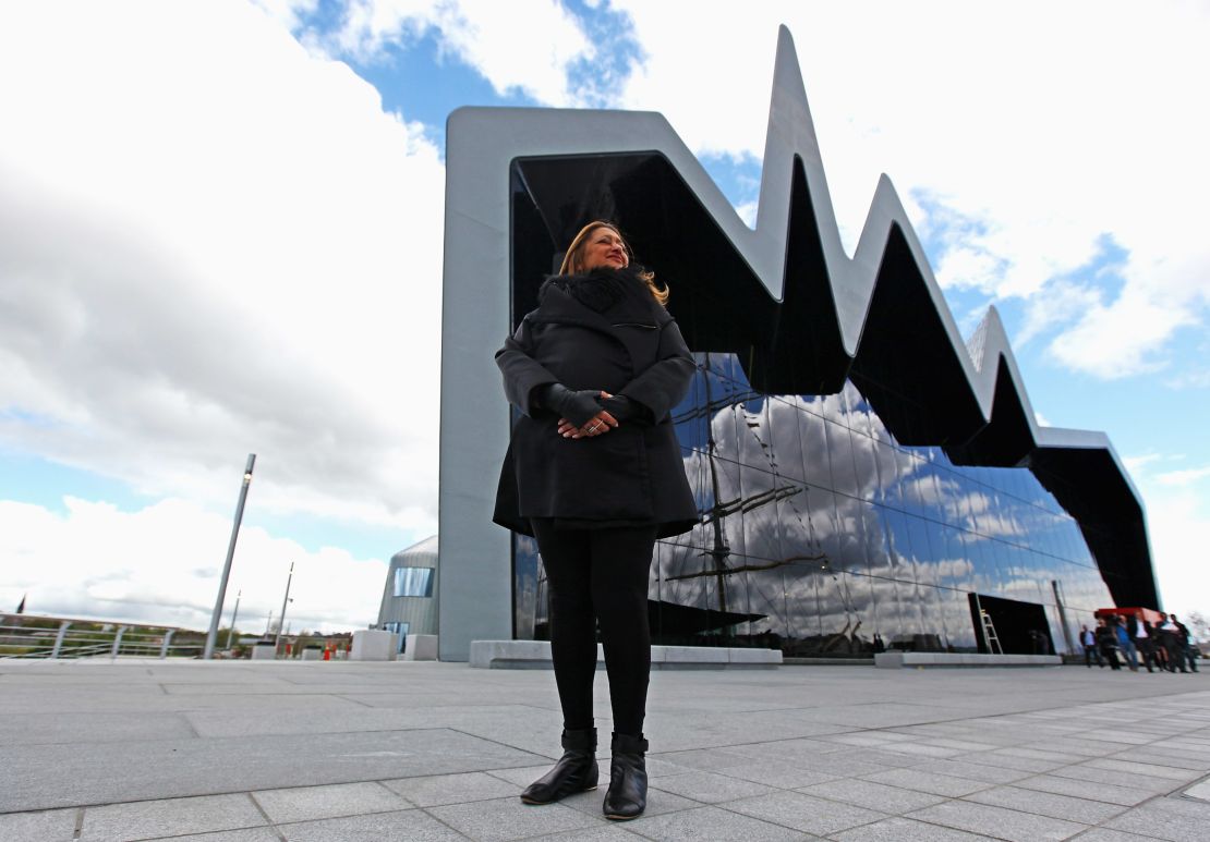 Architect Zaha Hadid, one of only two  women who have won the Pritzer Prize, stands in front of the Riverside Museum she designed for Glasgow, Scotland. 