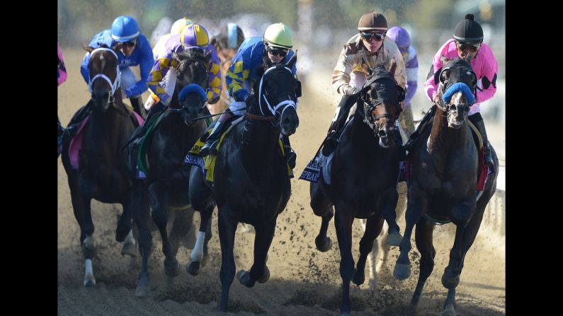 Napravnik and Shanghai Bobby, center, race down the track to win the Breeders' Cup Juvenile race.