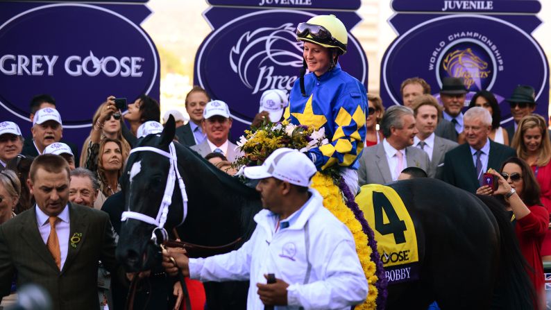 Napravnik and Shanghai Bobby are led into the winner's circle after winning the Breeder's Cup Juvenile race.