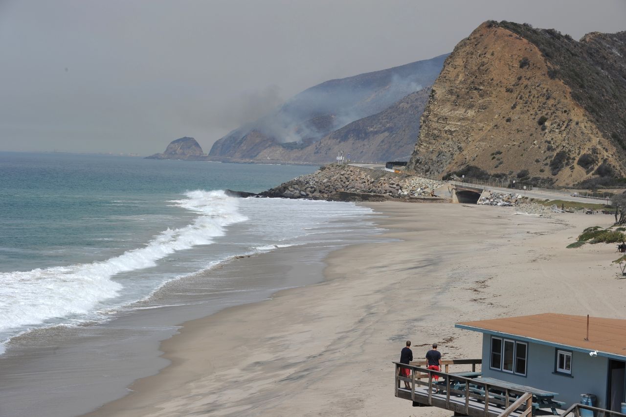 Lifeguards in Malibu, California, watch smoke rising from the wildfire burning near the Pacific Coast Highway on May 3.