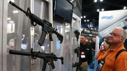 HOUSTON, TX - MAY 03: An attendee looks at a display of assault rifles during the 2013 NRA Annual Meeting and Exhibits at the George R. Brown Convention Center on May 3, 2013 in Houston, Texas. More than 70,000 peope are expected to attend the NRA's 3-day annual meeting that features nearly 550 exhibitors, gun trade show and a political rally. The Show runs from May 3-5. (Photo by Justin Sullivan/Getty Images)