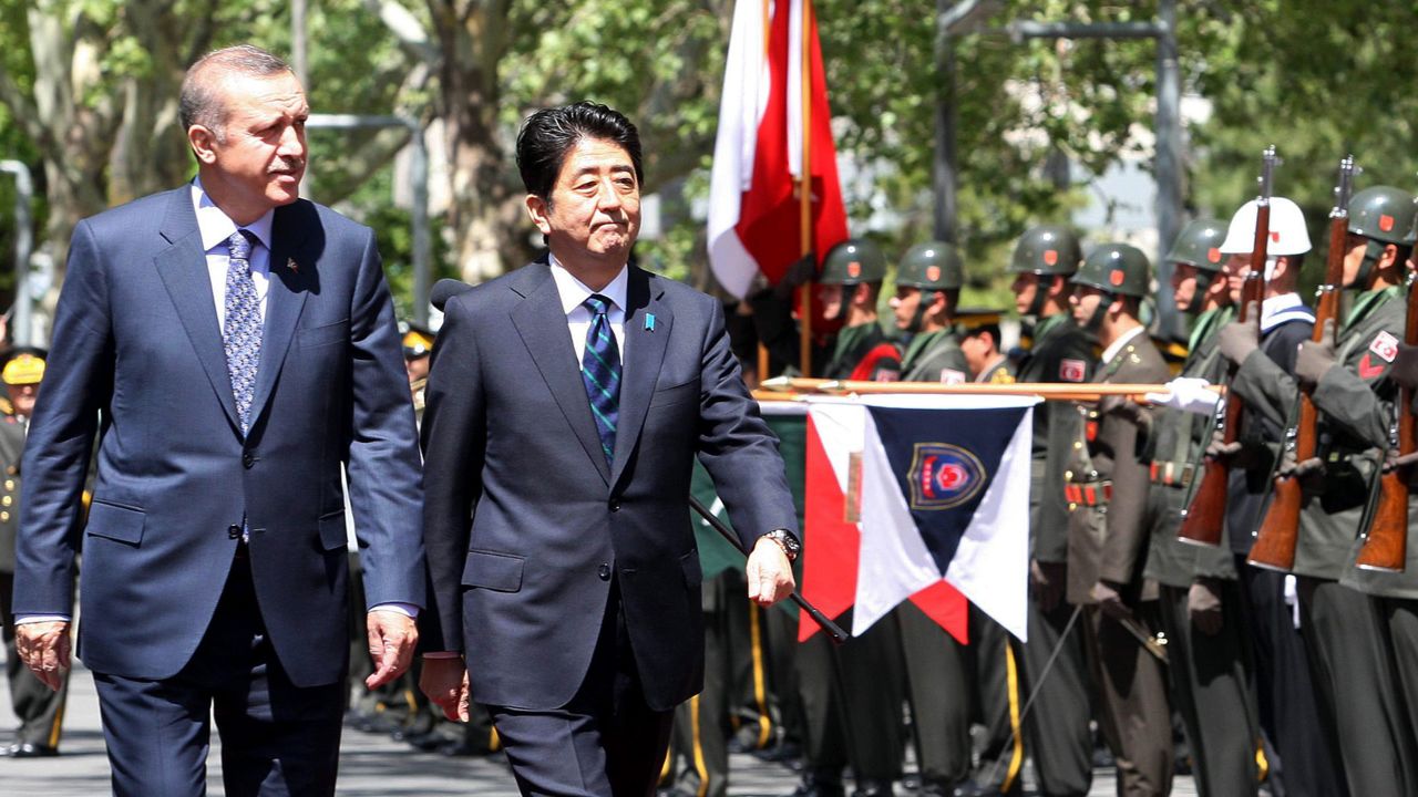 Japanese PM Shinzo Abe, right, and his Turkish counterpart Recep Tayyip Erdogan review an honor guard in Ankara on May 3.