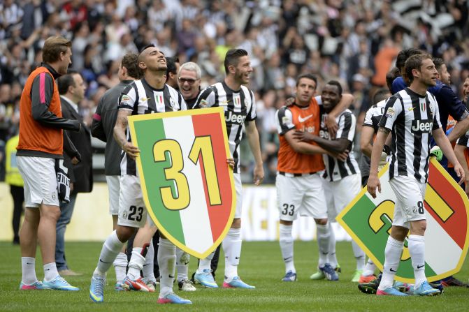 Arturo Vidal, who scored the winning goal from the penalty spot, holds a placard bearing the number 31 -- referring to the two titles Juve lost due to a match-fixing scandal.