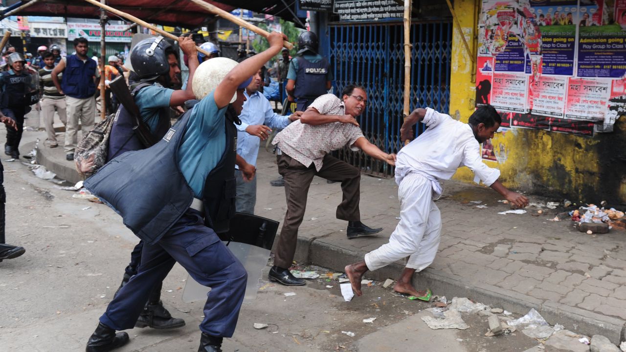 Bangladeshi police charge Islamists during clashes in Dhaka on Sunday.
