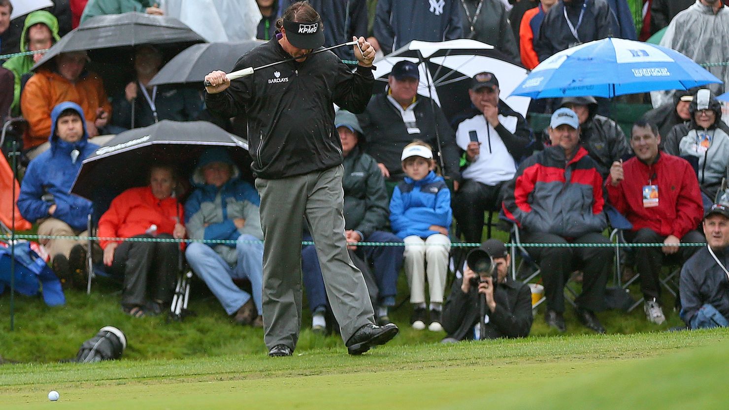 Phil Mickelson reacts to missing a birdie putt on the 18th hole at Quail Hollow, which meant he missed a playoff .