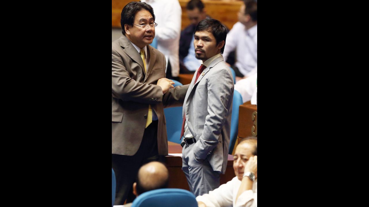 Pacquiao attends a plenary session discussing a proposed reproductive health bill at the House of Representatives at Congress in Quezon City, east of Manila, Philippines,  August 6, 2012.