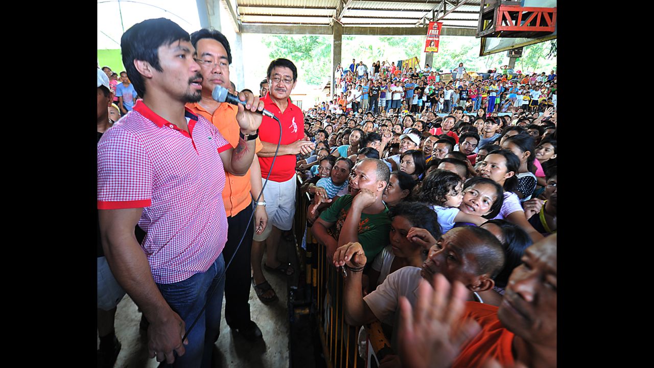 Pacquiao speaks to flood-affected residents at an evacuation center in Cagayan de Oro City, a southern island off Mindanao on December  23, 2011.