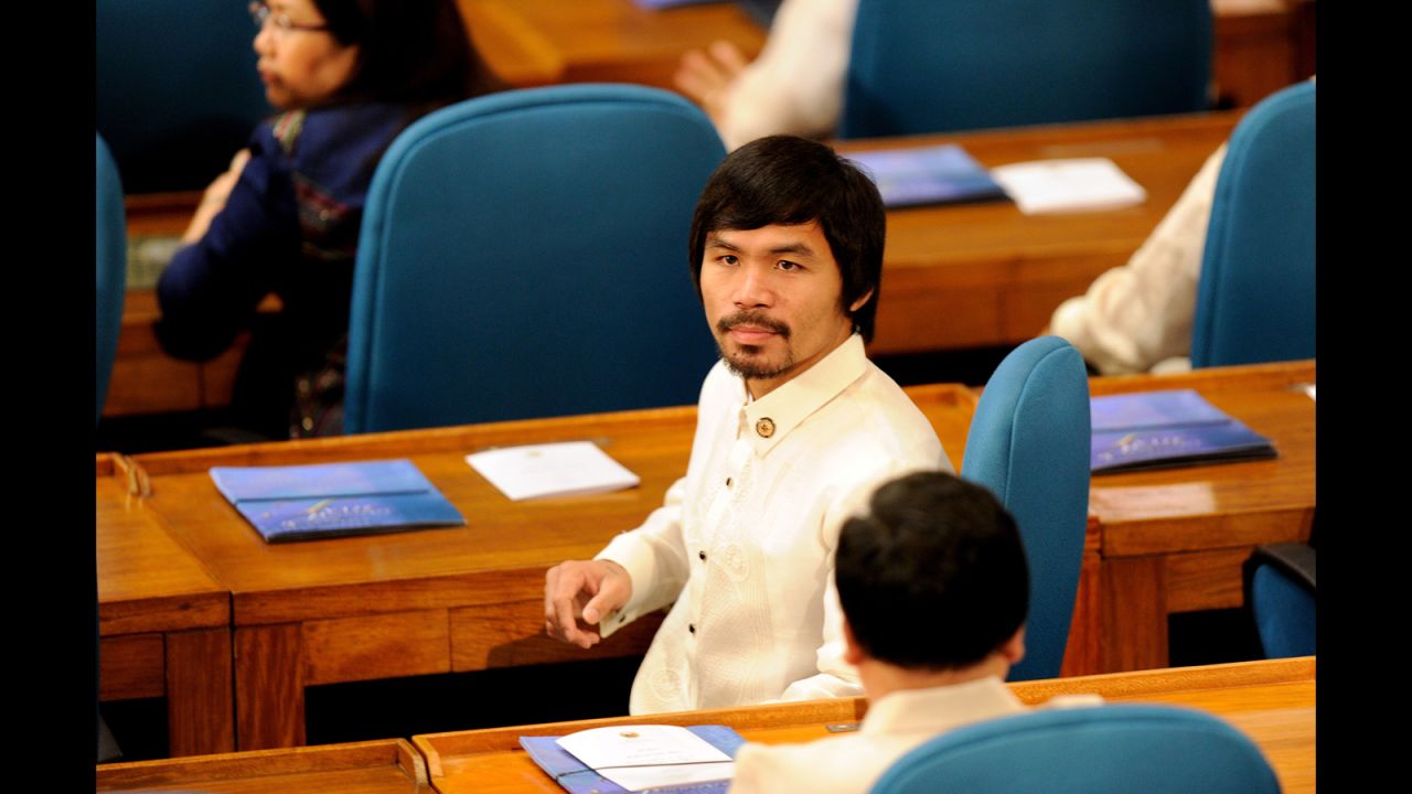 Pacquiao sits with fellow lawmakers during the 15th Congress at the House of Representatives in Quezon City on July 25, 2011.
