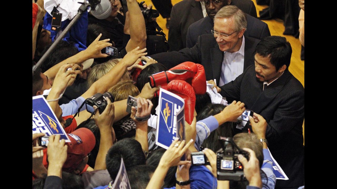 Pacquiao joins Harry Reid, a Nevada senator, on the campaign trail at the Orr Middle School in Las Vegas, Nevada, on October 29, 2010, ahead of the midterm U.S. elections.