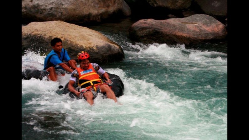Pacquiao tries out whitewater rafting to promote tourism in his district in New La Union in Maitum, Sarangani province, on August 14, 2010.