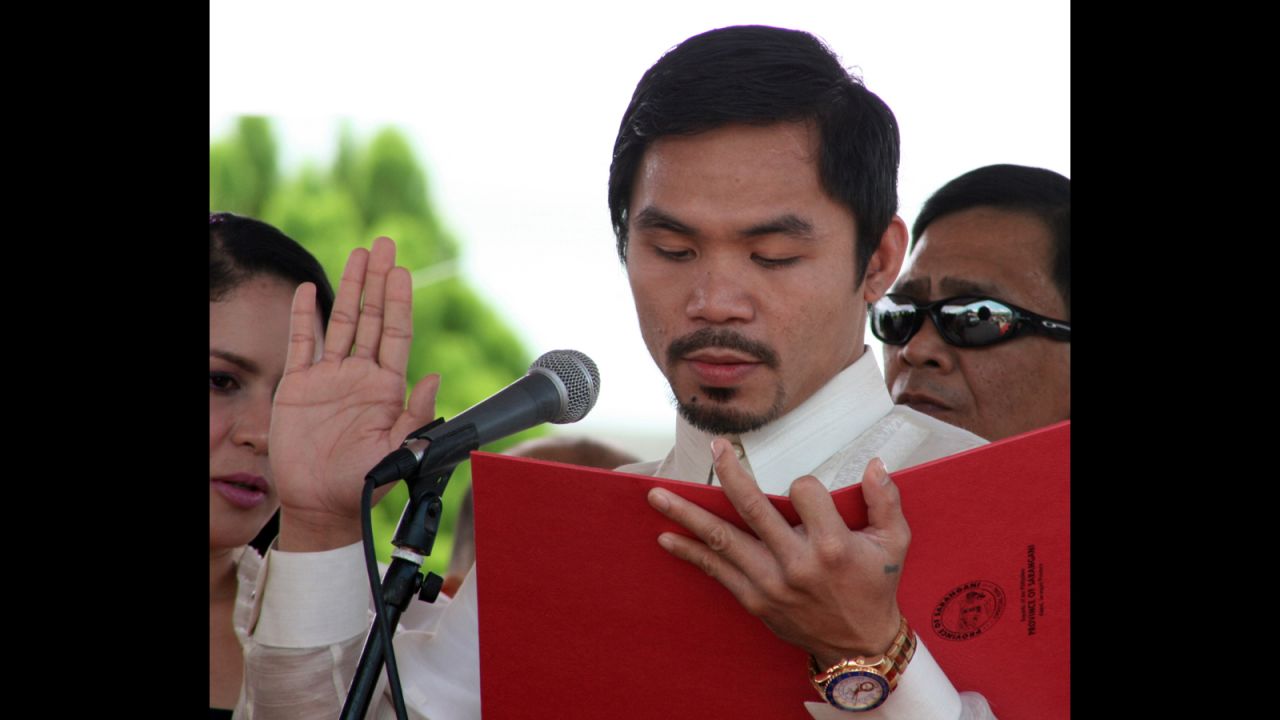 Pacquiao takes his oath of office as congressman at the provincial capitol in Alabel, Sarangani province, on June 28, 2010.