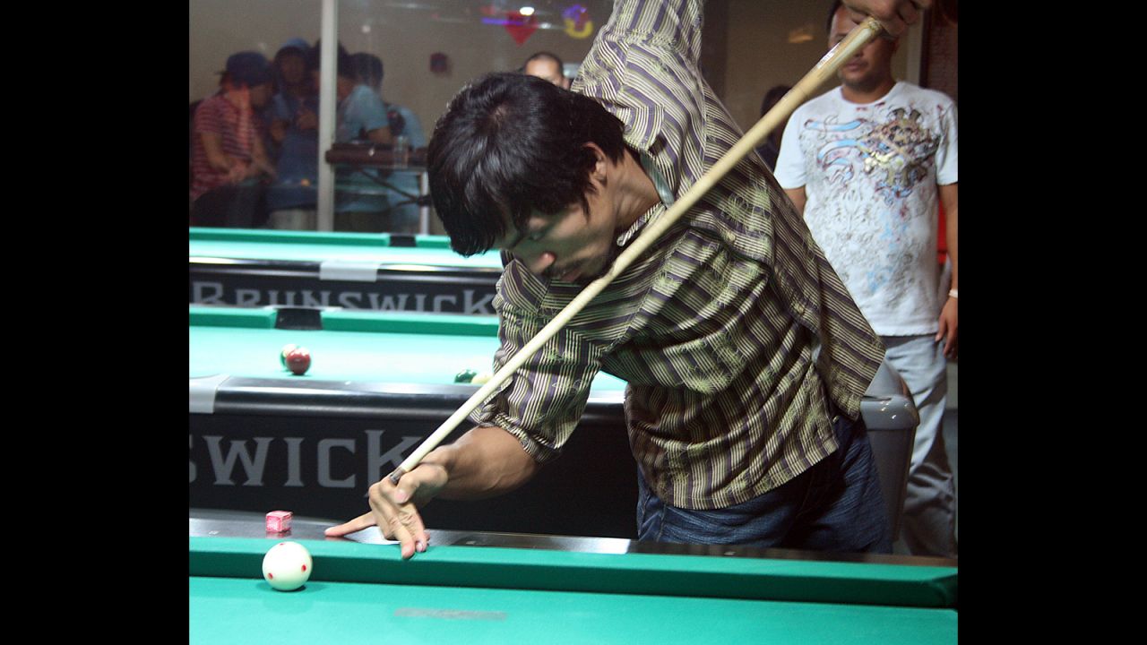 Pacquiao plays billiards at his recreational center in General Santos, Mindanao, in May 2010.